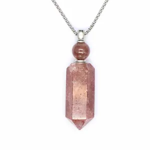 Detail view of hexagonal strawberry crystal aromatherapy bottle necklace pendant.