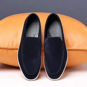 Top view of navy blue suede loafers showing fine stitching and slip-on design