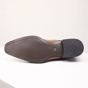 Close-up detail of brown leather loafer sole showing size 42 and anti-slip heel texture