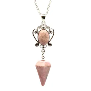 Detail view of natural pink stone hexagonal cone pendant with vintage silver necklace