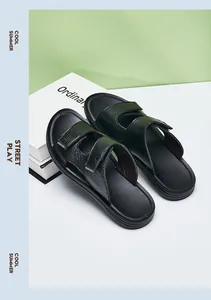 Detailed view of men's black textured leather slide sandals for summer