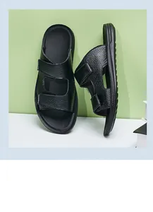Detailed side view showing the pebbled leather texture of men's black summer sandals