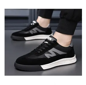 Men's retro black German Army Trainer style sneakers with thick white soles detail.