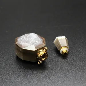 Close-up of hexagonal agate perfume bottle necklace with screw cap and natural druzy top
