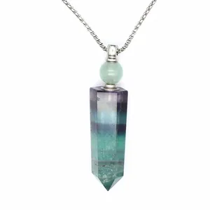 Detail view of natural hexagonal prism crystal aromatherapy bottle necklace pendant
