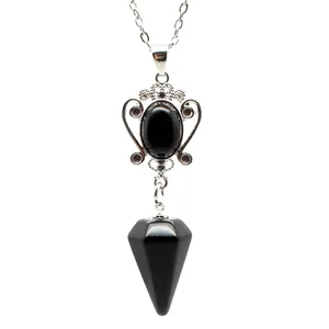 Close-up of a natural black stone pendant necklace with silver decorative setting