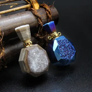 Macro view of detailed natural druzy agate perfume bottle pendants in blue and beige finish