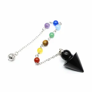 Detailed view of a seven chakra crystal pendulum with a black obsidian cone pendant.