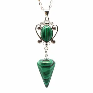 Detailed view of a malachite hexagonal cone pendant necklace in ornate silver setting