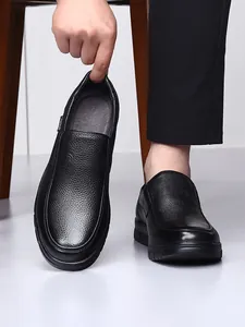Close-up of black pebble grain leather men's slip-on loafers with flexible heel
