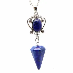 Detail view of a natural lapis lazuli stone pendant with a faceted hexagonal cone shape.