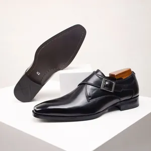 Detailed view of elegant black leather monk strap loafers with adjustable buckle