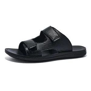Detail shot of black leather men's sandals with adjustable straps and non-slip sole.