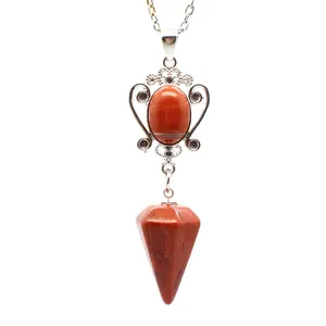 Macro detail view of a natural red jasper hexagonal cone pendulum pendant necklace.