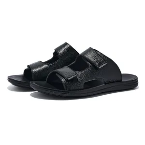 Detail view of black textured men's summer slides with adjustable double velcro straps