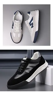 Close-up detail of vintage German army trainer sneakers in white and black leather.