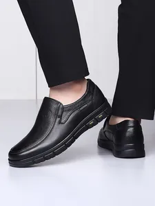 Detail of black pebbled leather men's slip-on loafers for breathable casual wear