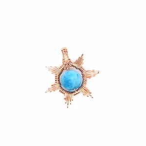 Detailed macro shot of a sun-shaped pendant with a blue natural stone centerpiece.