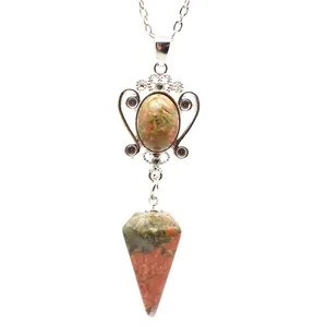 Close-up of unakite crystal necklace featuring decorative silver frame and cone pendant
