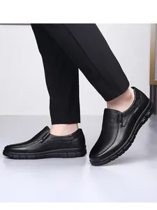 Detailed view of comfortable black genuine leather loafers for men with durable soles