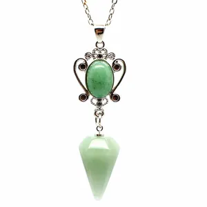 Detailed macro view of a vintage style natural green stone hexagonal pyramid pendant necklace.
