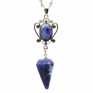 Detailed view of the blue natural stone pendant with vintage hollow metal work