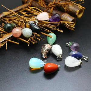 Collection of various teardrop-shaped natural stone crystal pendants for jewelry