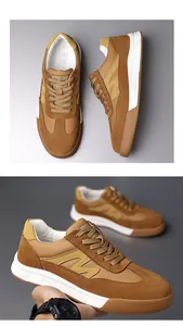 Detailed macro view of men's retro brown sneakers featuring suede and leather patchwork design