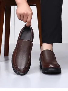 Close-up of brown textured leather loafers for men with durable black sole