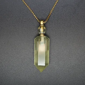 Close-up of a natural hexagonal prism crystal perfume bottle pendant necklace with gold chain