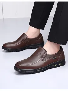 Close-up of brown textured cowhide men's slip-on loafers with durable sole
