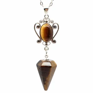 Detailed view of a natural tiger eye hexagonal cone pendant with silver-tone chain