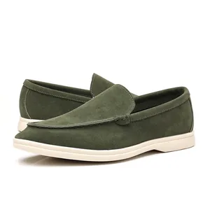Detailed side view of olive green suede loafers for men with lightweight white soles.