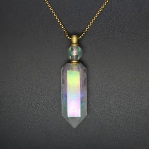 Close-up of rainbow crystal hexagonal prism perfume bottle necklace with gold chain.