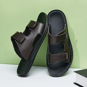 Detailed view of the brown leather texture on these non-slip summer slides for men