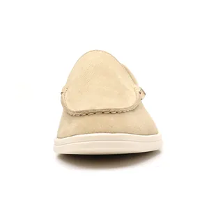 Front view of a breathable beige suede slip-on loafer for men showing the moc-toe design