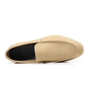 Overhead detail view of comfortable tan suede slip-on loafers for men with black interior