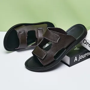 Close-up of brown textured leather men's summer slippers with anti-slip sole
