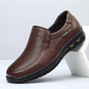 Detailed view of premium brown top layer cowhide slip-on loafers for men with textured finish