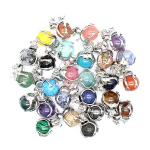 Detailed frog pendants holding various natural gemstone beads in multiple bright colors