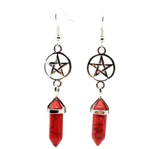 Detailed close-up of red turquoise hexagonal pillar earring with hollow pentagram charm