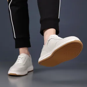 Detail view of men's genuine leather casual sneakers with non-slip brown rubber sole