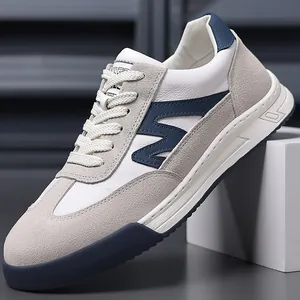 Detailed view of retro white leather German Army Trainer sneakers with blue accents