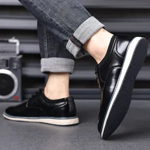 Detail view of stylish men's black leather shoes featuring a comfortable white sole.