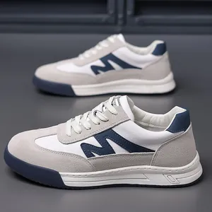 Stylish men's retro German army trainers featuring thick soles and blue M-logo leather detail