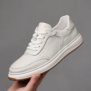 Men's white genuine leather casual sneakers with minimalist design and textured finish