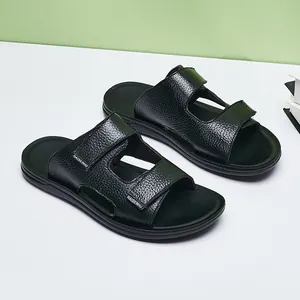 Close-up detail of black men's sandals with leather texture and adjustable straps