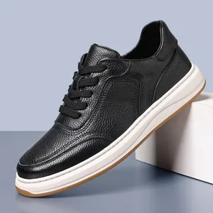 Close-up of black top grain cowhide men's sneakers with textured leather
