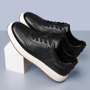 Detailed view of black men's casual sneakers featuring premium cowhide leather and white soles