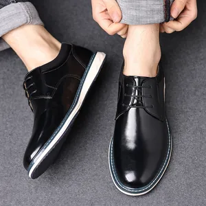 Macro detail of polished black leather men's dress shoes featuring classic lace-up design